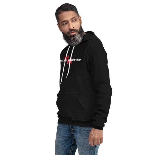 A man donning a Modern Warrior Hoodie flaunting the Modern Warrior Hoodie's red logo.