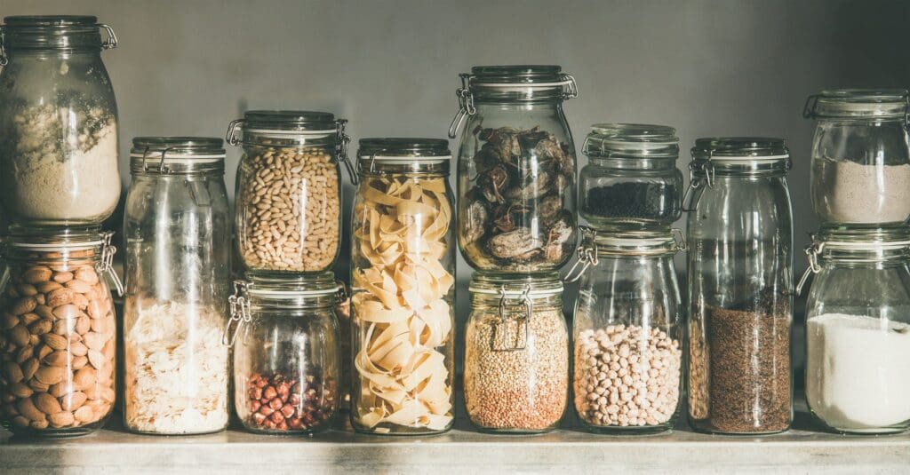 Rustic kitchen food storage arrangement in glass jars