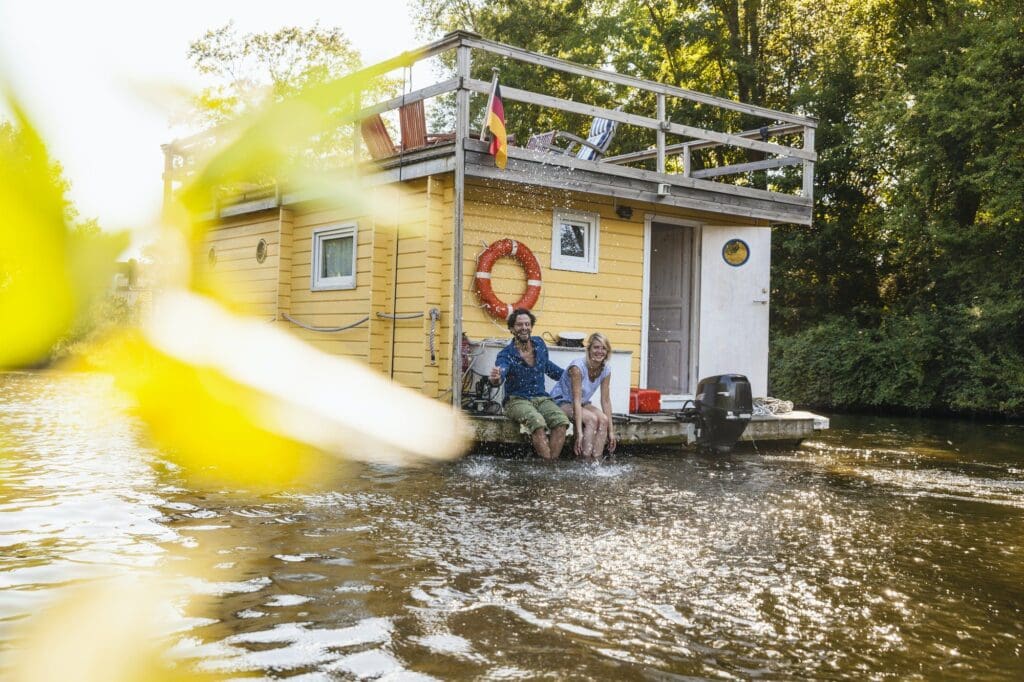 Happy couple having a trip on a house boat