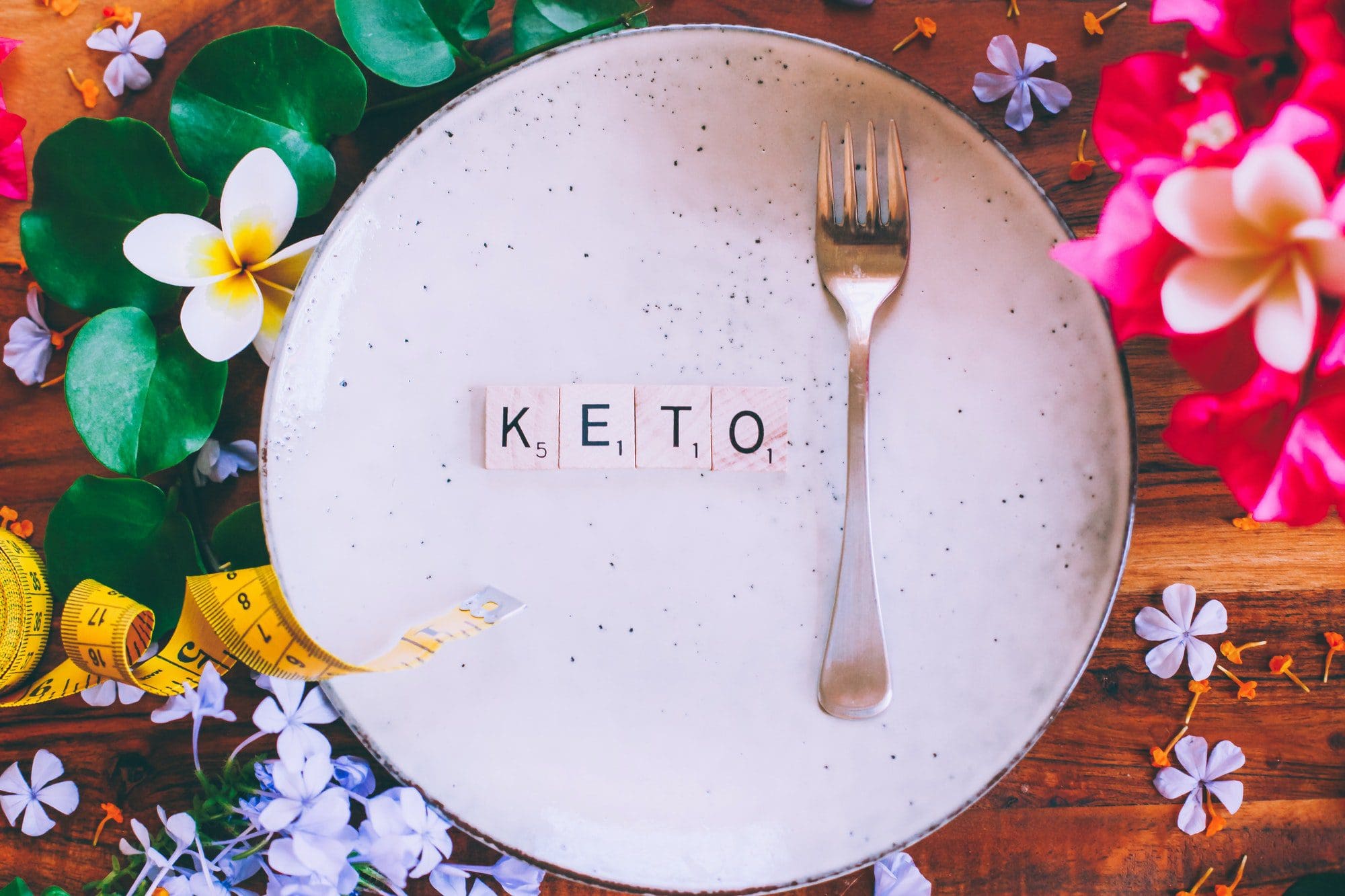 Keto diet and Silver fork lying on a plate