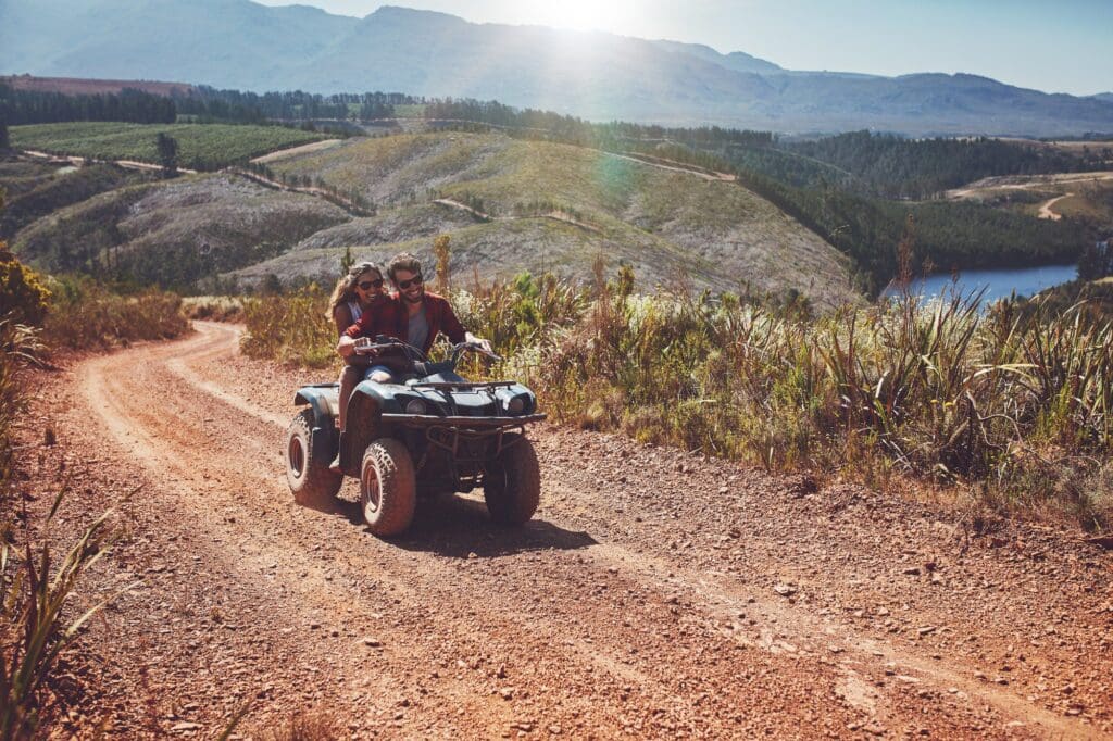 Young couple enjoying off road vehicle ride