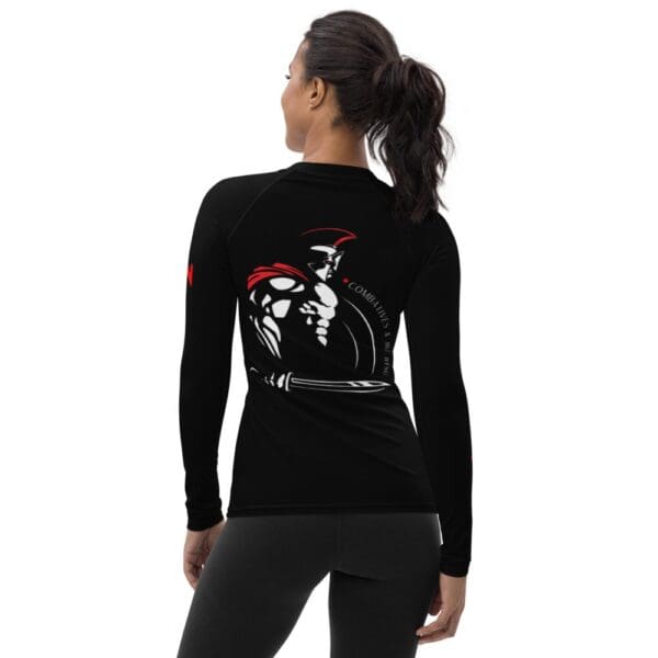 A MW Combatives Women's Rash Guard worn by a woman.