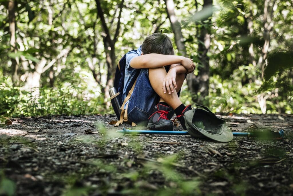 Evacuation Planning Boy lost and sad in the forest