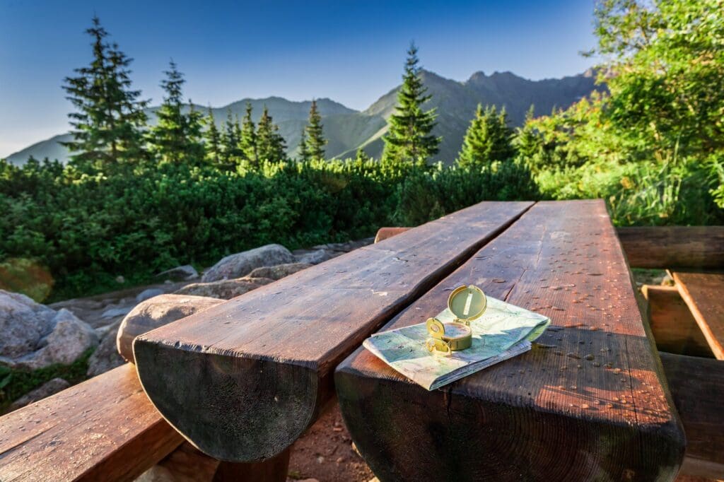 Navigation in mountains in summer with map and compass, Poland