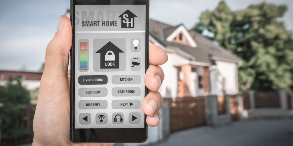 A person holding a smart phone while practicing self defense in front of a house.