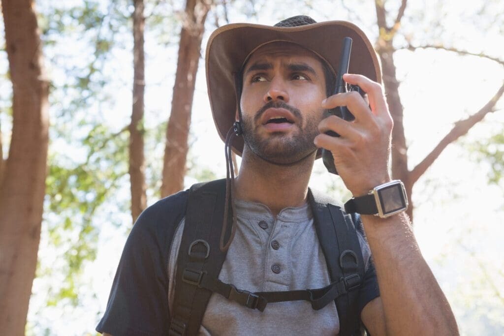 Man using walkie-talkie in the forest