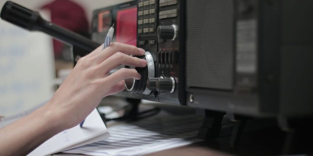 A person is using a radio to make a call.