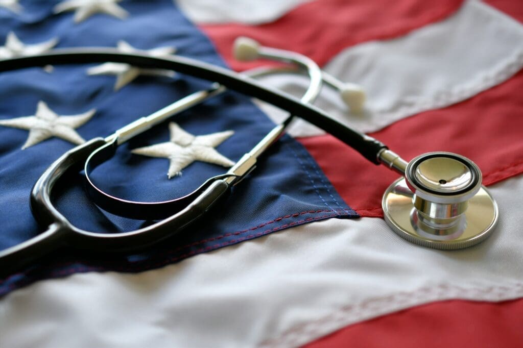 United States America healthcare medical concept - stethoscope on American flag,