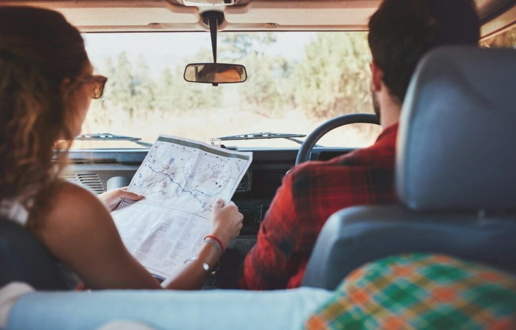 Couple driving on country road